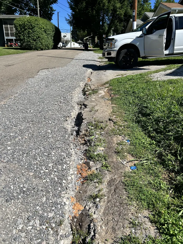 Damaged driveway edge washed out by runoff in Knoxville, Tennessee