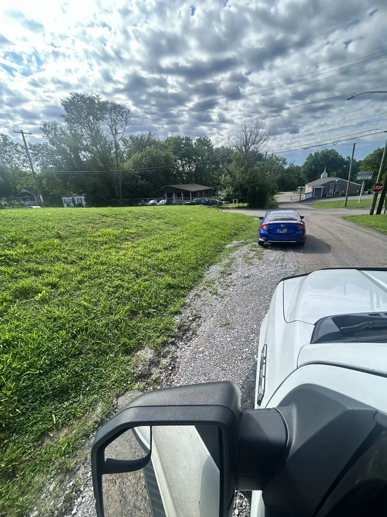 Gravel shoulder along a road before paving in Knoxville, Tennessee