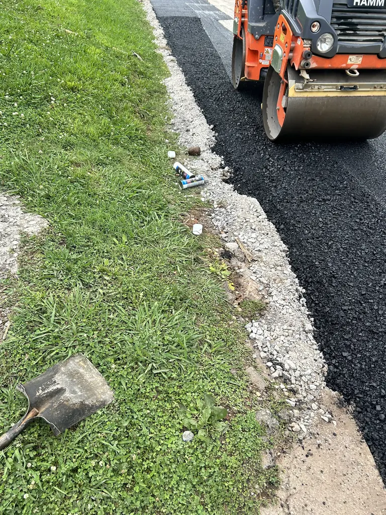 Roller compacting a new asphalt strip in Knoxville, Tennessee