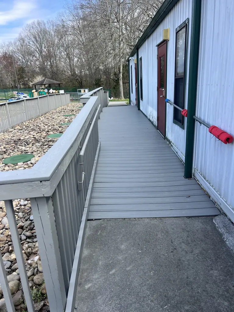 Accessible ramp with railings leading to a building entrance in Knoxville, TN