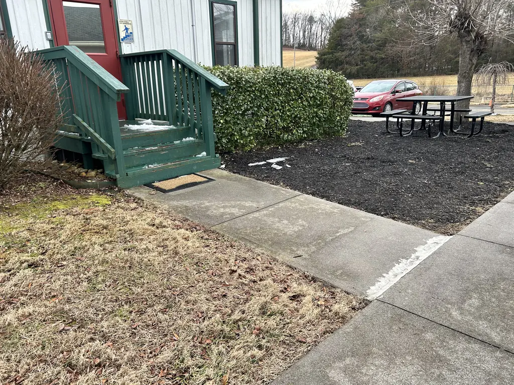 Exterior stairs and landing with painted railings in Knoxville, Tennessee