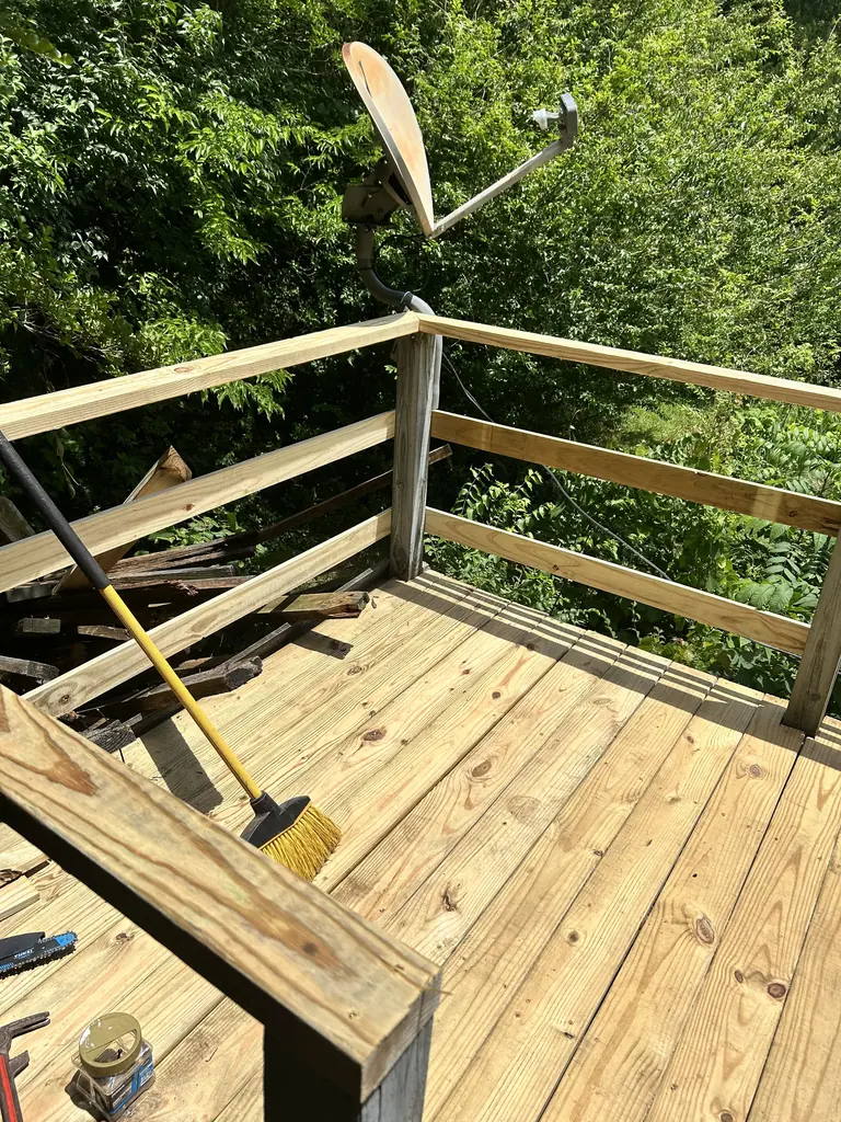 New wood deck with the railing going up in Knoxville, Tennessee