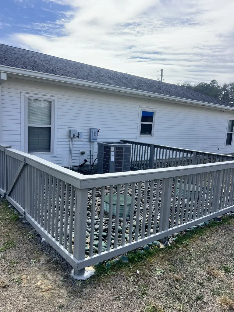 Vinyl railing enclosing a back patio area in Knoxville, Tennessee