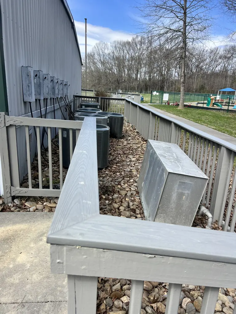 Walkway railing beside the mechanical units of a building in Knoxville, Tennessee