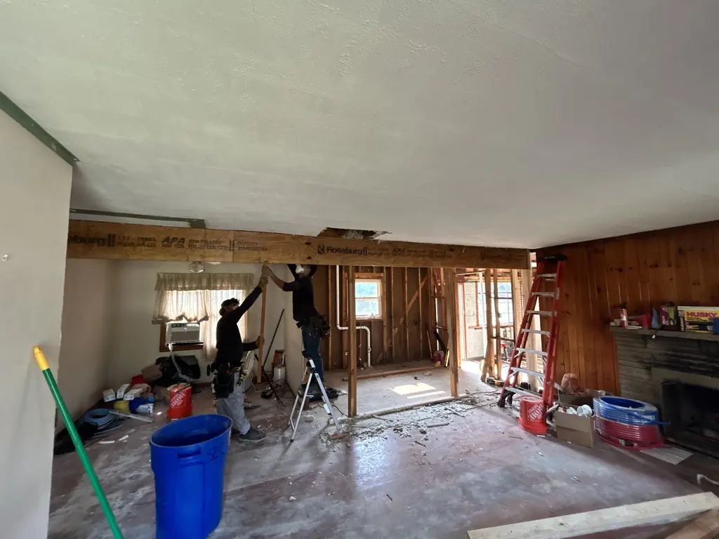 Crew member framing an opened wall in Knoxville, Tennessee