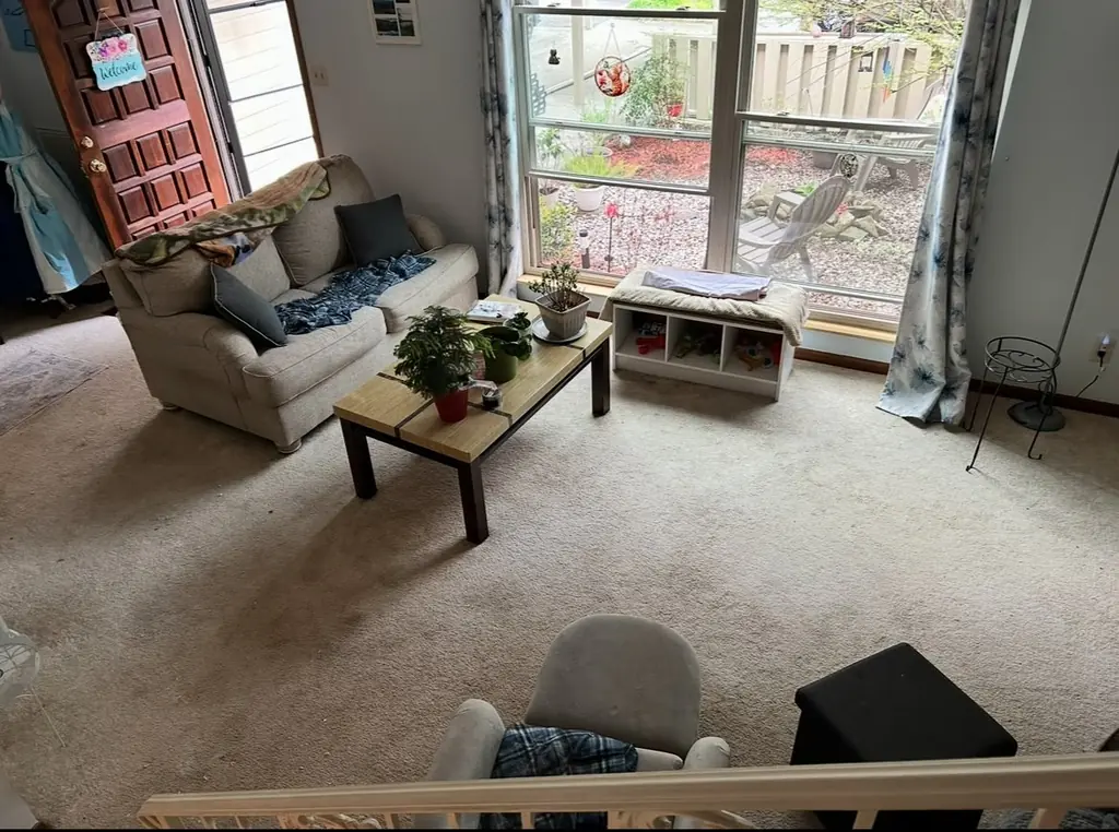 Living room with the old carpet still down in Knoxville, Tennessee