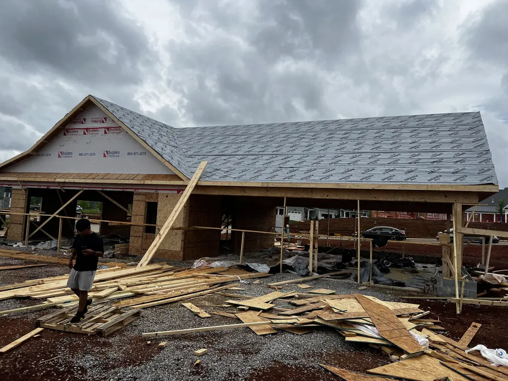Crew working on a framed house on a Knoxville, Tennessee job site