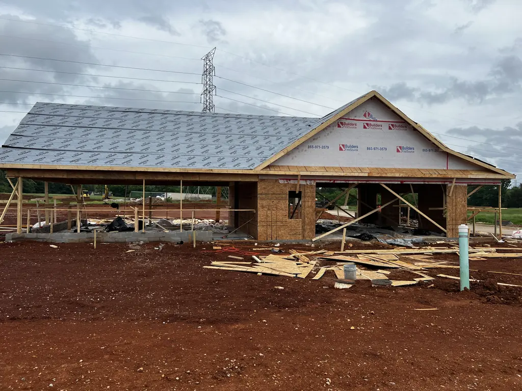 New roof completed over framed walls on a Knoxville, Tennessee build