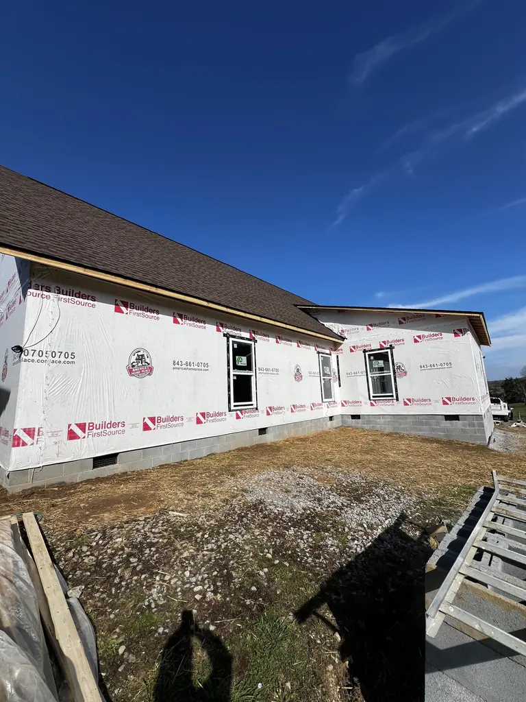 Ranch home with the roof on and the walls wrapped in Knoxville, Tennessee
