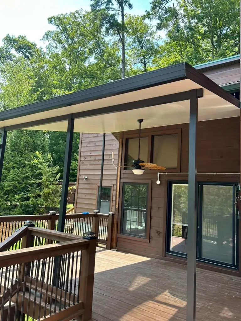 Finished patio cover with a ceiling fan over a back deck in Knoxville, Tennessee