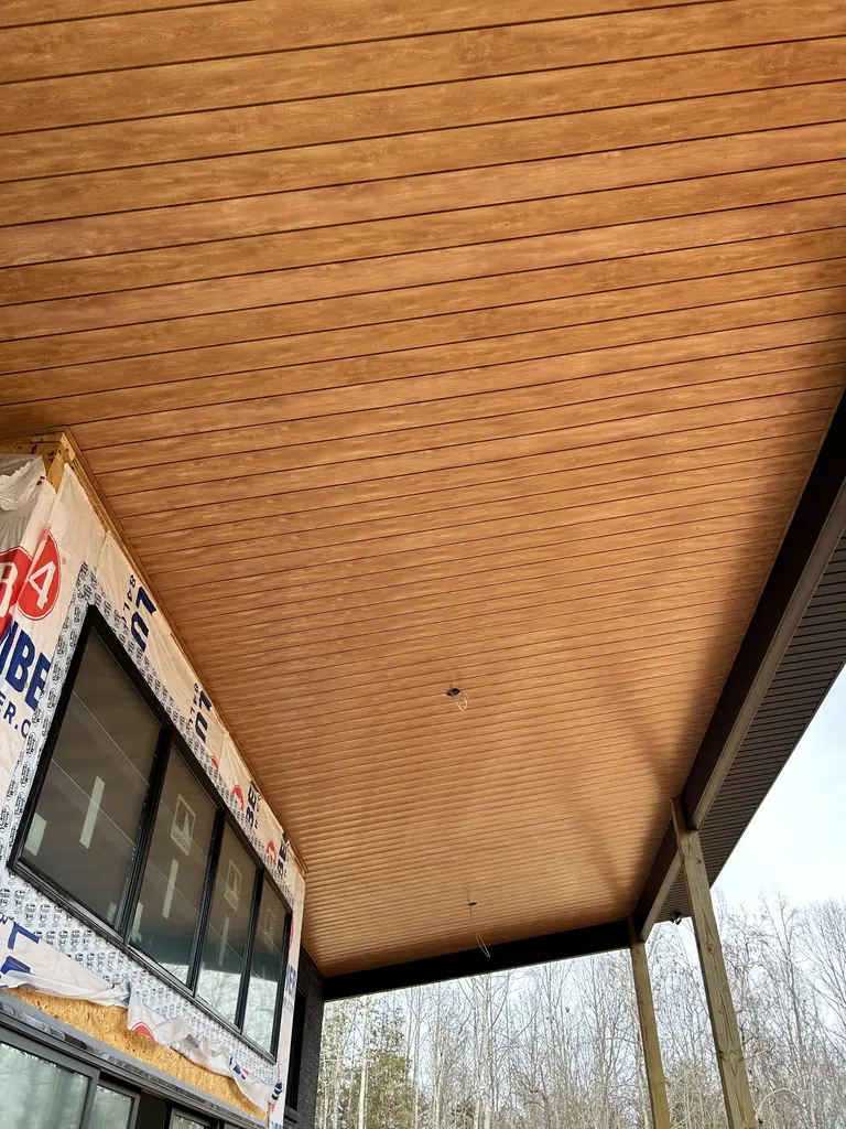 Patio cover with a finished tongue-and-groove ceiling in Knoxville, Tennessee