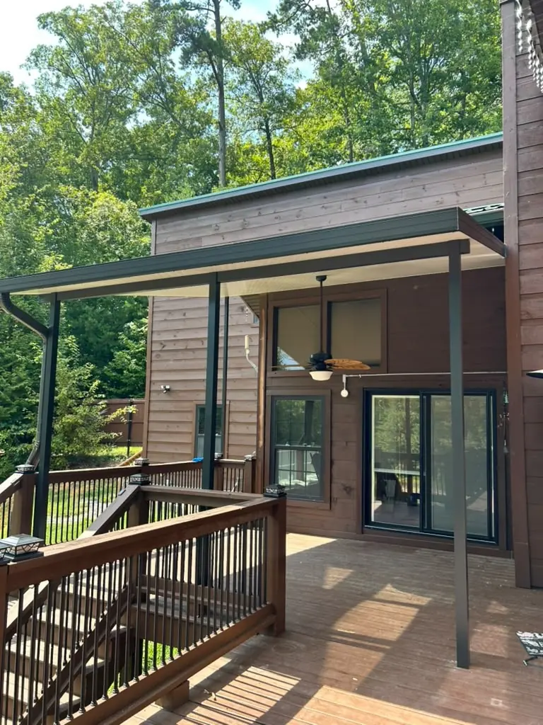Metal patio cover built over a back deck in Knoxville, Tennessee