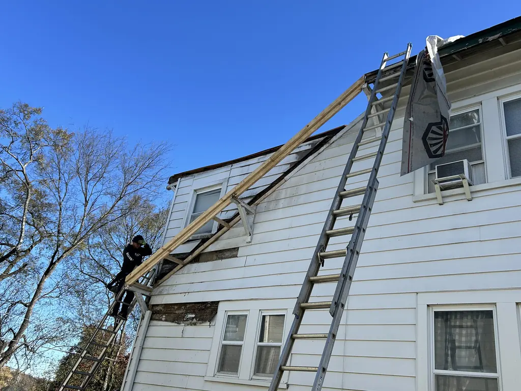 Ladder set against the house for a roof replacement in Knoxville, Tennessee