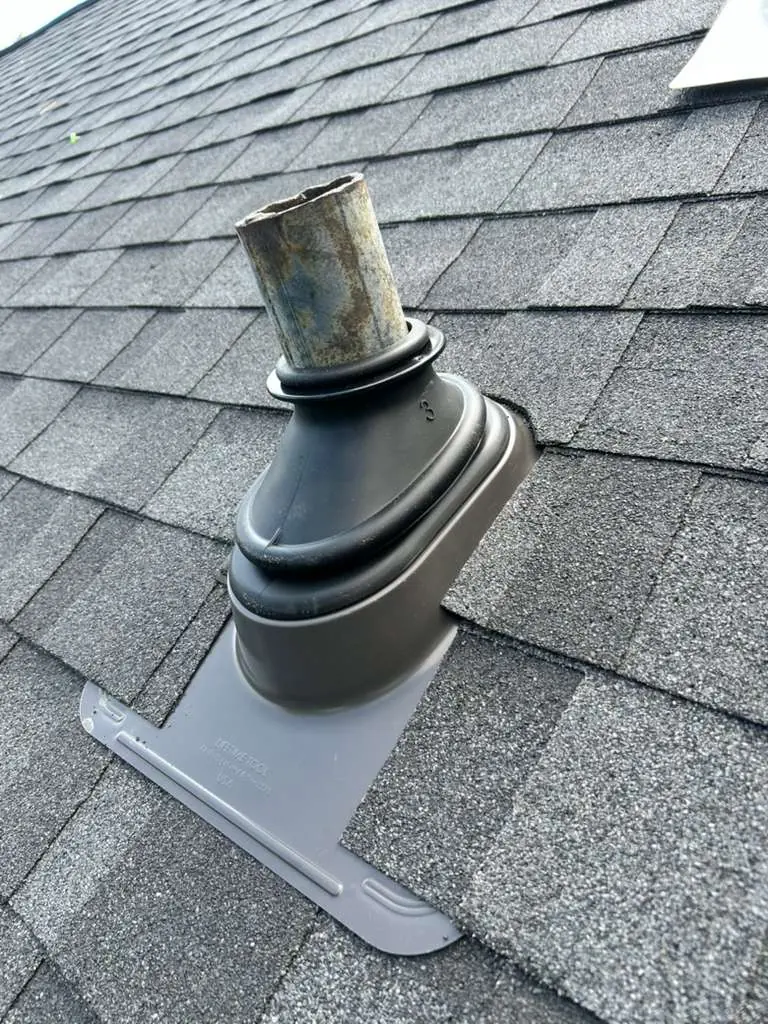 New pipe boot set into a finished shingle roof in Knoxville, Tennessee