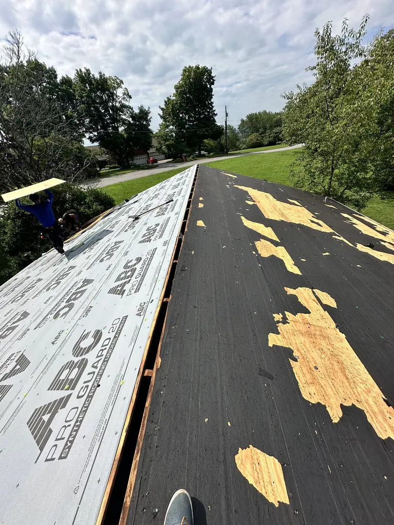 Synthetic underlayment rolled out over the roof deck on a Knoxville, TN job